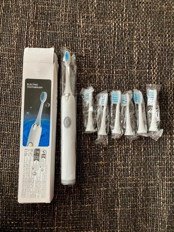 Elektrická zubná kefka a ústná sprcha