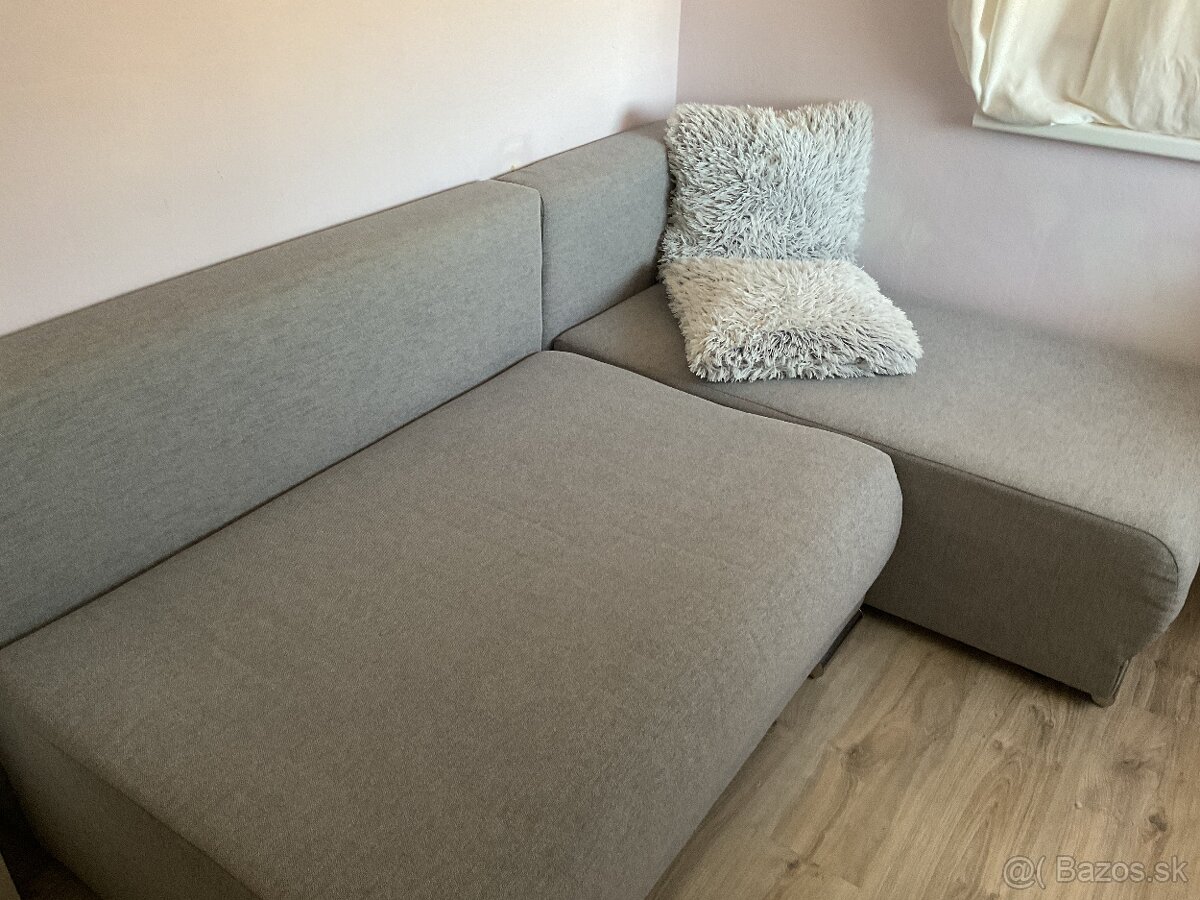 Rohová sivá rozkladacia sedačka 255x200