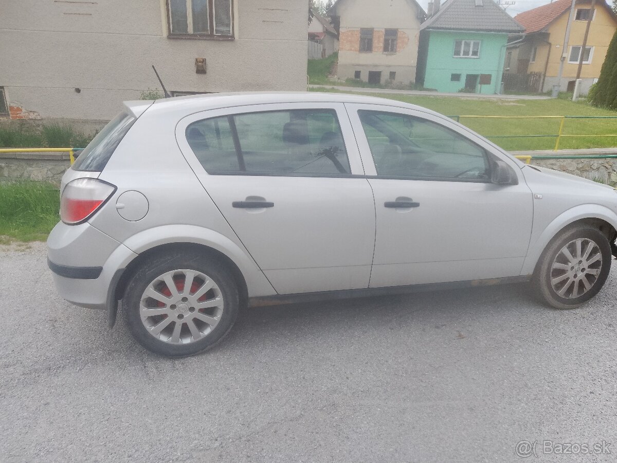 Astra twinsport 1.6 benzín 77kw