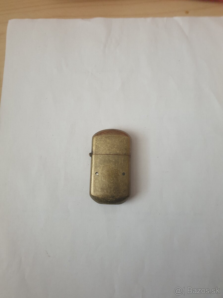 Mosadzny zapalovac.