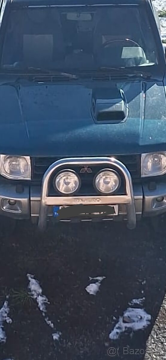 Pajero 2 predný rám Hella svetlá originál Mitsubishi