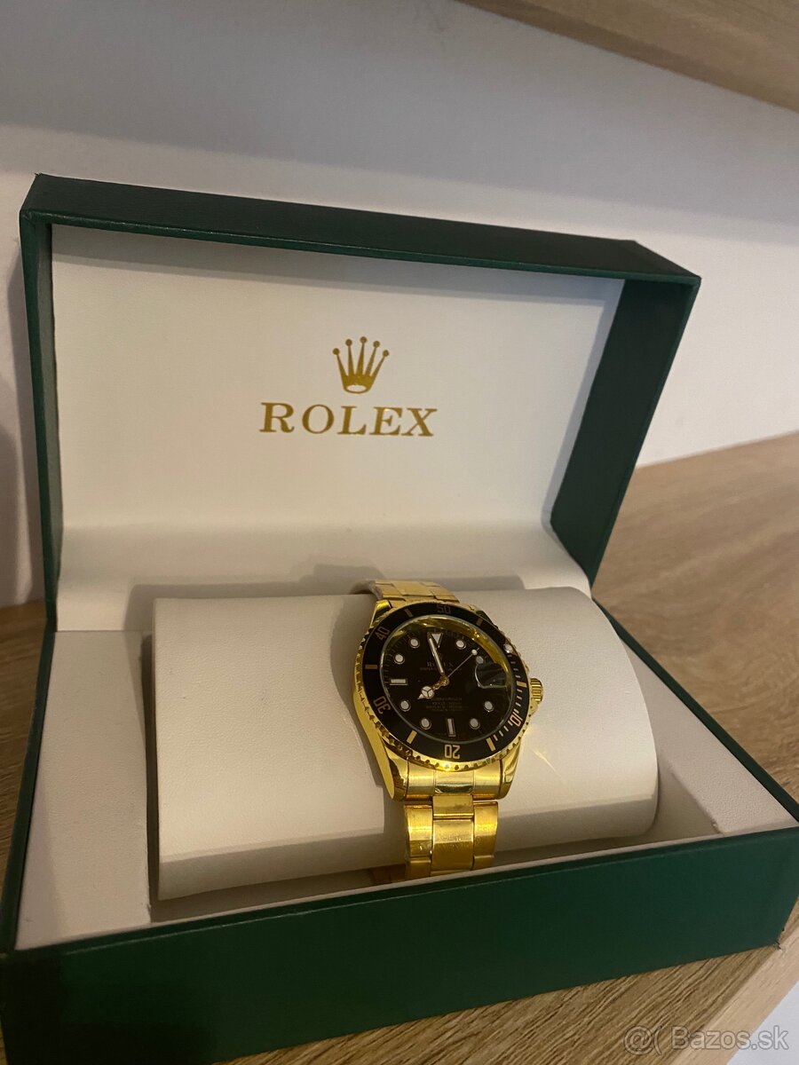 Rolex Submariner - yellow gold, black dial