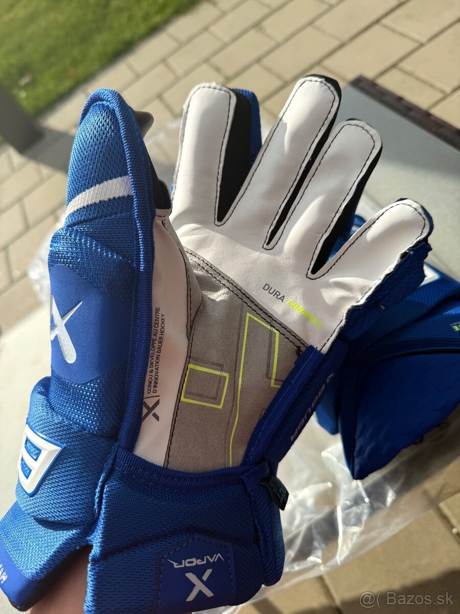 Rukavice Bauer Hyperlite červené , modré 14”