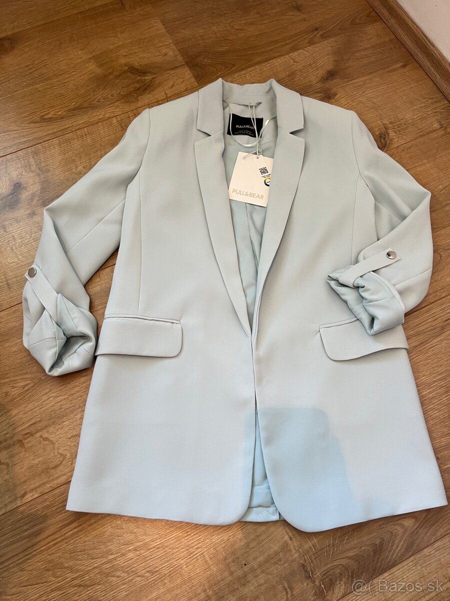 Tyrkysové sako s visačkou