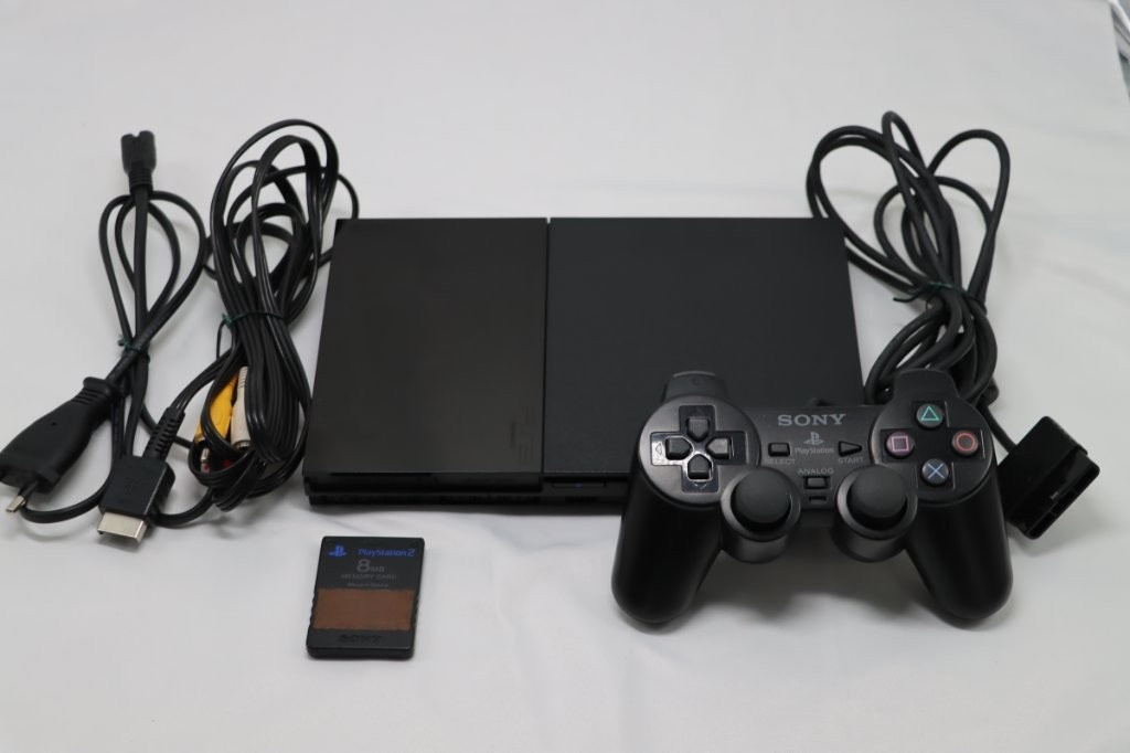 Playstation 2 plus ovládač a hry