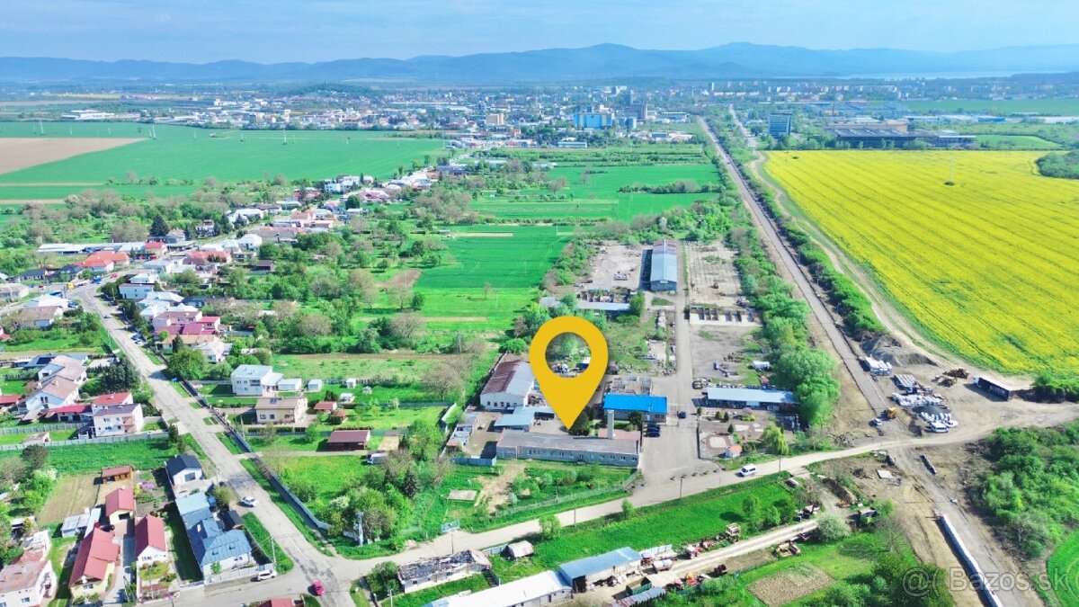 Byty, kancelárie, garáže a pozemok