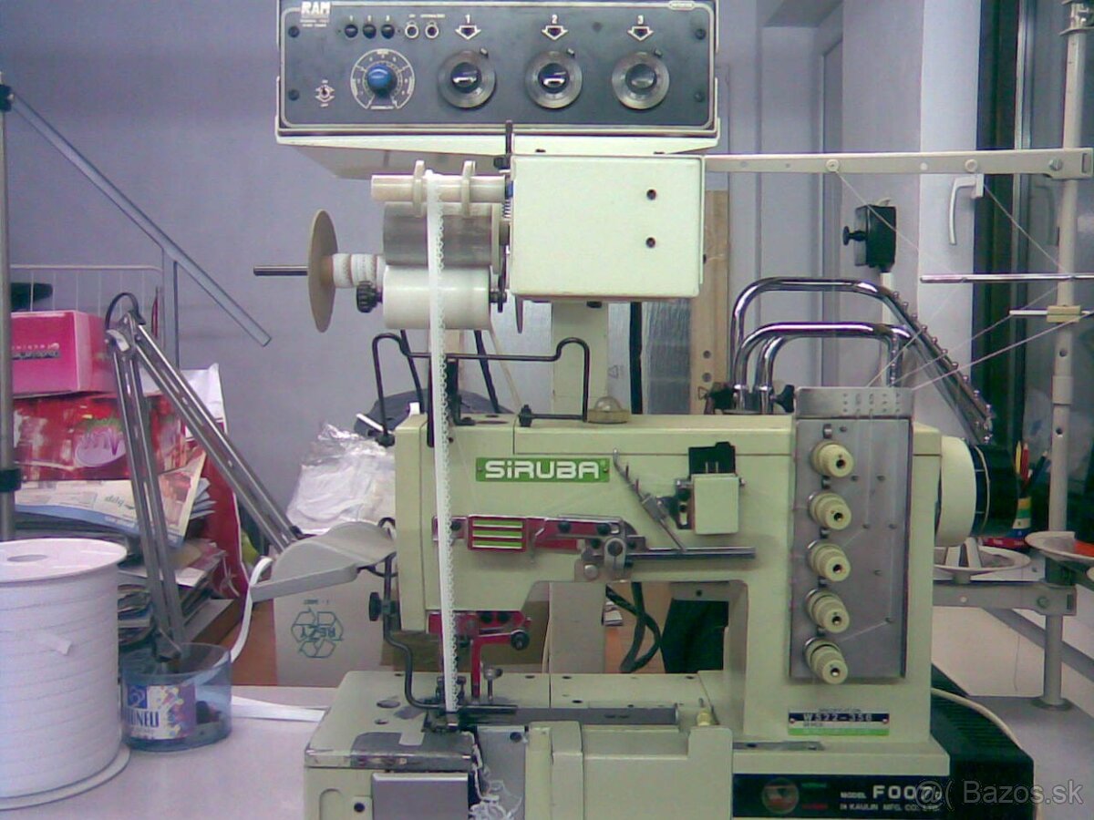 sijaci stroj  so zariadenim na nasivanie gumy