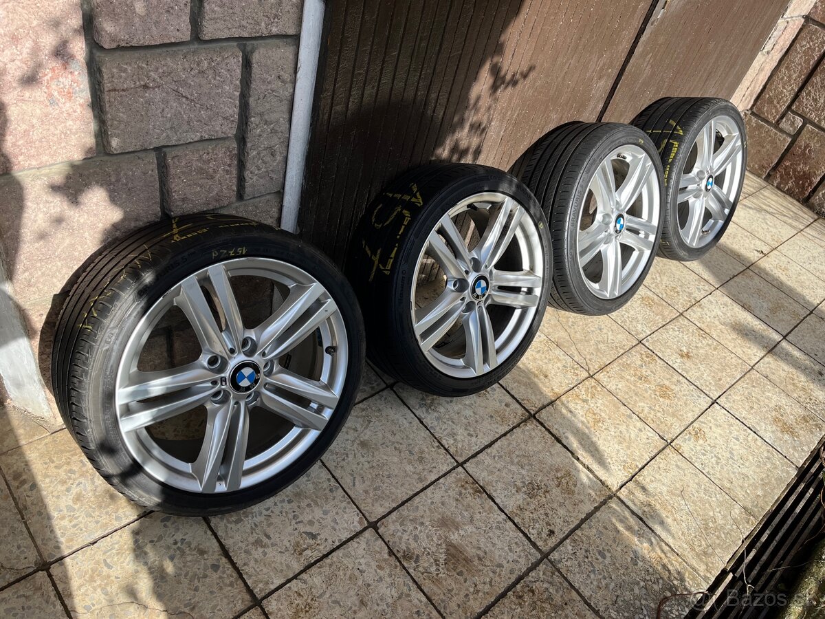 BMW original disky s pneu R18