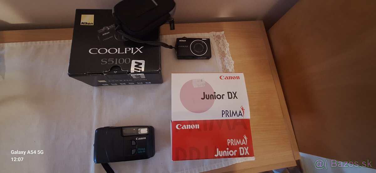 Coolpix S5100  Canon Junior DX Prima
