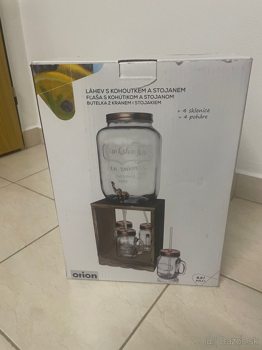 Suprava nápojovej fľaše s kohútikom