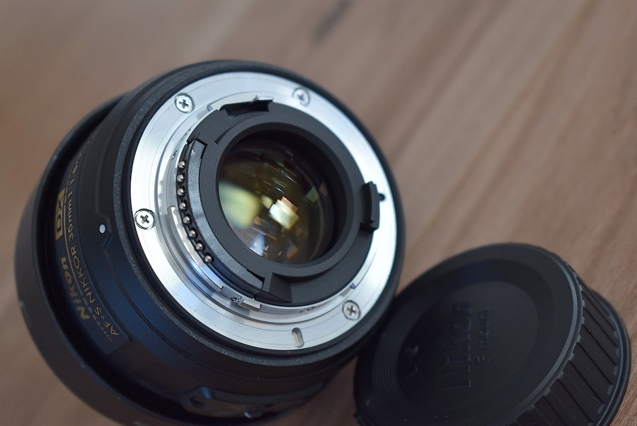 Nikkor 35 mm AF-s 1,8G nikon - clona krytky vrecko + filter - 10