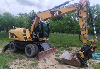 Caterpillar M313D kolesový bager - 10