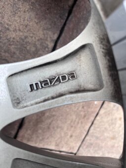 Orig. hliníkové disky Mazda 2 R15, 4x100 - 10