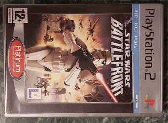 Playstation 2 + 2 ovládače + 3 hry - 11