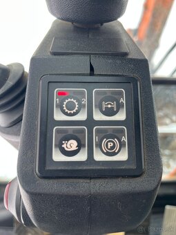 Kolesové rypadlo CASE WX145 - 12