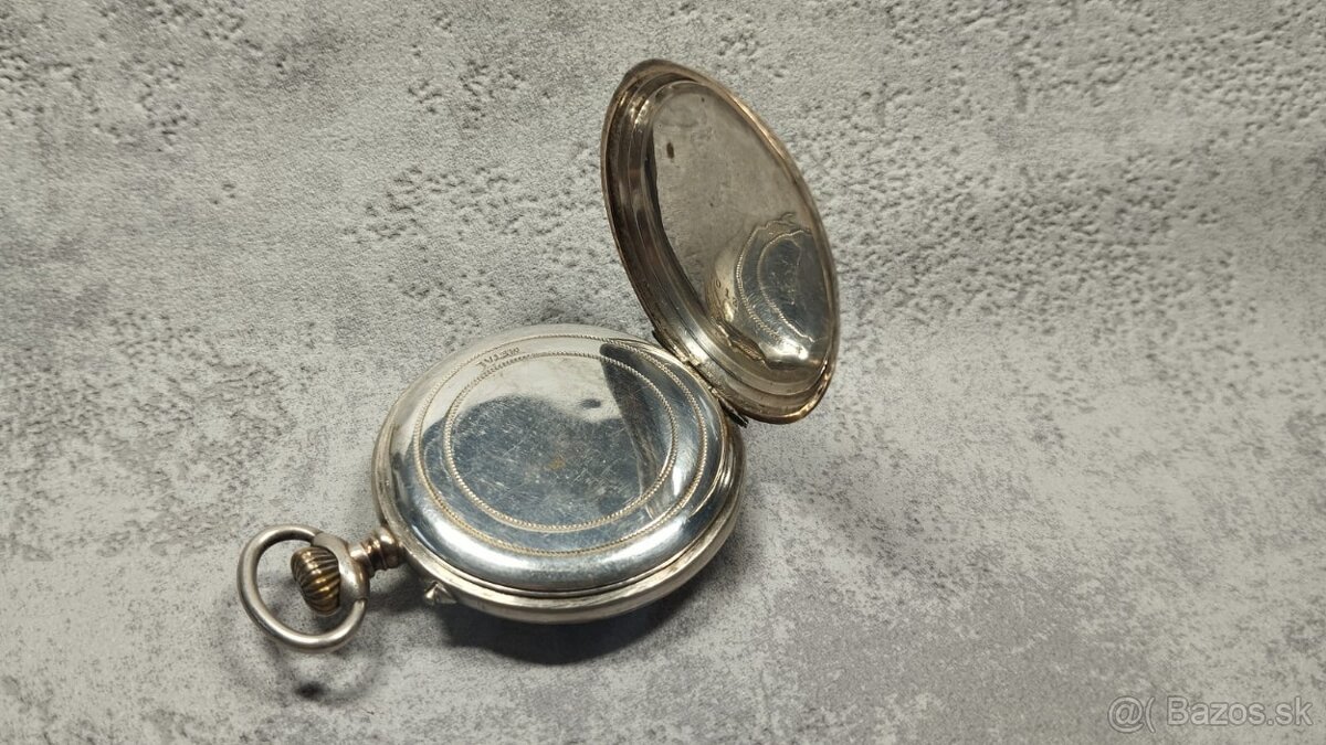 Pánské stříbrné zdobené kapesní tzv. štýrské hodinky. AG - 16