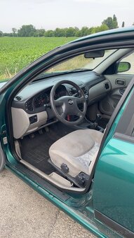 Nissan Almera N16 - 16