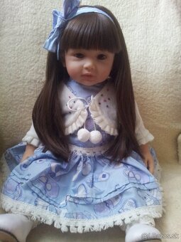 Realisticka babika s oblecenim - 18