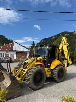 Výkopové práce traktor bagrom