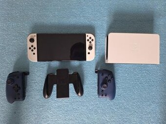 Nintendo Switch OLED + 7 hier + 2x Joy-Con + púzdro – stav a