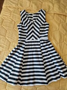 Elastické šaty s áčkovou sukňou Orsay v. 36 - 1