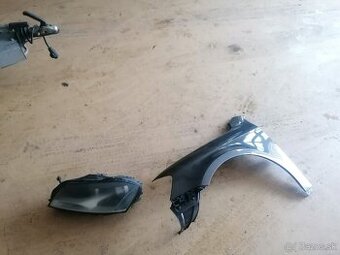 Passat b7 - Ľavý blatník +svetlo halogen