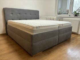 Čalúnená manželská posteľ 180 cm s úložným priestorom.