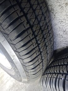 Predám pneu.zanovne s disky land Rover freelander 195/80r15