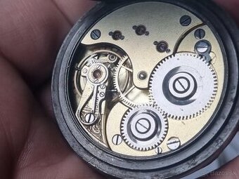 Vreckové hodinky,Omega,s mikroreguláciou.