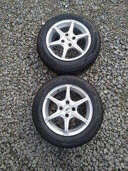 14" alu 4 x 100 + nové zimné 175/65 14.
