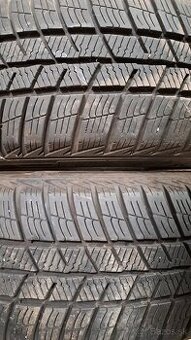 Predám 2ks slušné zimné 185/60r14-82T Barum