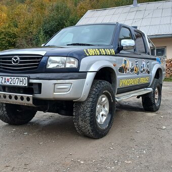 Mazda b2500.       Big food.