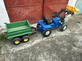 Traktor s vlečkou a radlicou