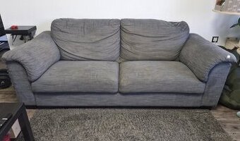 Starší šedomodrý pohodlný gauč