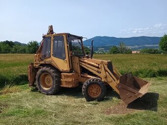 Predam traktorbager 4x4 výroba CGT 322 licencia cayerpilar