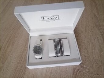 Predam dámské nove hodinky s naramkom.