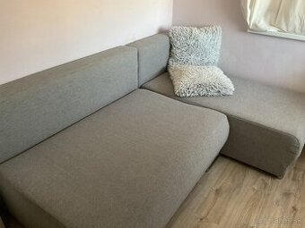 Rohová sivá rozkladacia sedačka 255x200