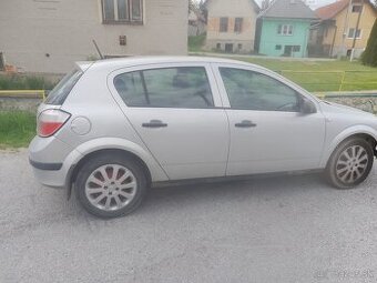 Astra twinsport 1.6 benzín 77kw