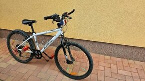 Biely bicykel zn. Rockrider 300