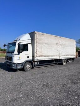 Valník MAN s hydraulickým  čelom