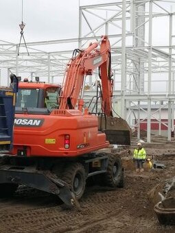 DOOSAN DX140W Kolesový báger - rýpadlo