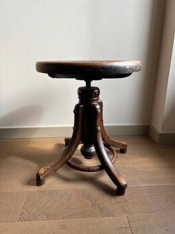 Otočná starožitná stolička pod piáno Fischel