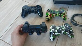 PS3 super slim + 7 ier na HDD + 4 x ovladac + volant