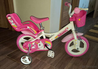 Predam detsky bicykel pre zacinajucu jazdkynu s nosicom pre