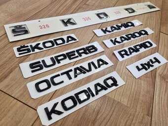Škoda znaky nápis čierny logo znak emblem