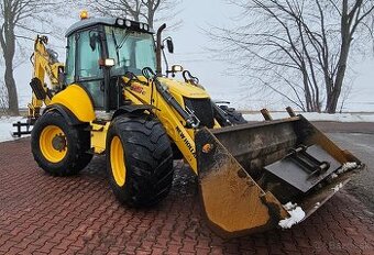 Traktorbager New Holland B115 C