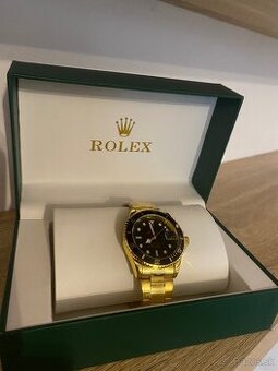 Rolex Submariner - yellow gold, black dial