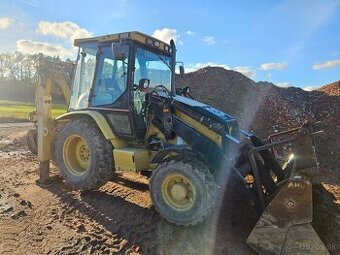 Traktorbagr Caterpillar 428D 4X4 + sbíjecí kladivo