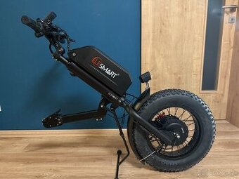 Prídavný elektrický pohon na invalidný vozík