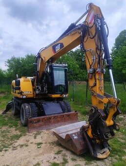 Caterpillar M313D kolesový bager